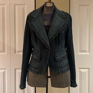 This denim jacket is super cute with the added ruffles.